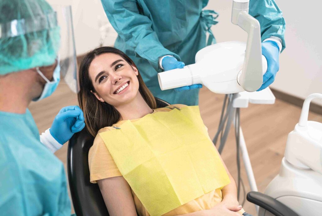 Patient receiving a dental X-ray examination at the clinic.